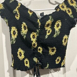 Black Sunflower top with tie. Easily adjustable.